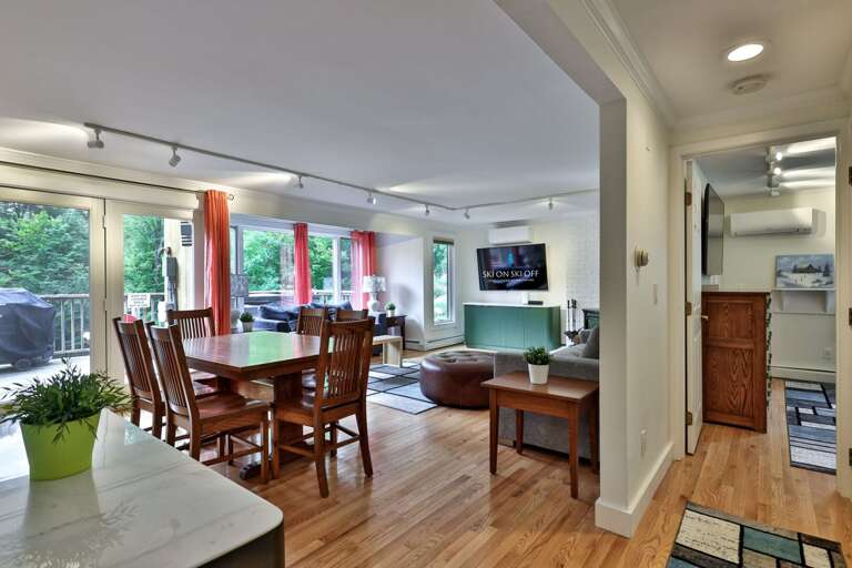 Dinner can be casual here, with the kitchen opening directly onto the dining table and sofas.
