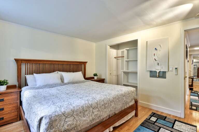 Hang your clothes in the bedroom closet instead of living out of a suitcase beside the king bed.