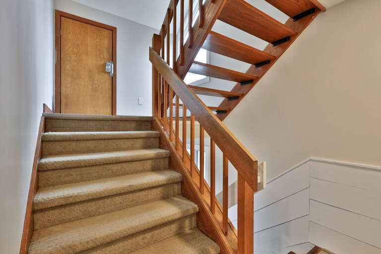 A glimpse of the bright, vaulted living area that waits just past the entry.