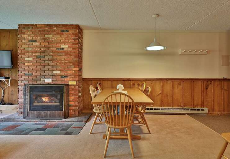 Experience the coziness of our living room, complete with a charming gas fireplace.