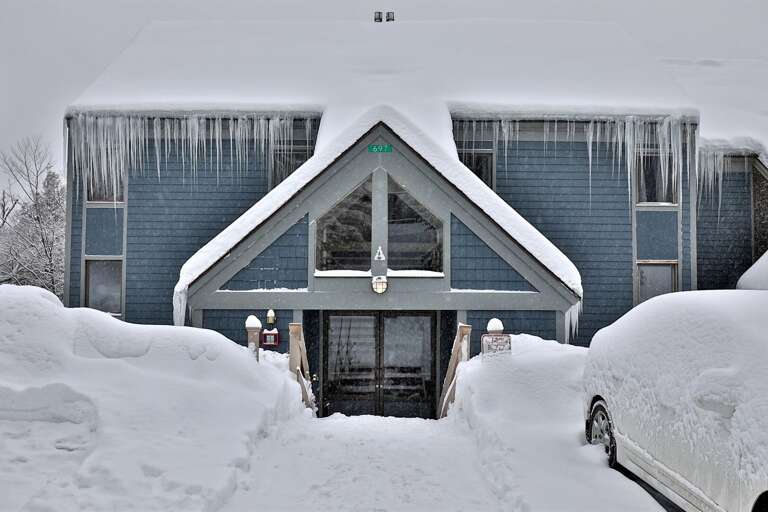 Experience the cozy charm of our snow-kissed condo, complete with parking facilities right out front, perfect for a relaxing retreat!