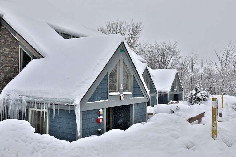 Experience the winter wonderland in our cozy property, nestled within a building dusted with snow and encased in glistening ice.