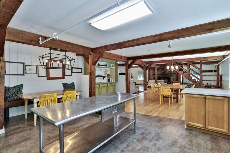 The central worktable adds prep space while keeping cooks connected to the dining room.