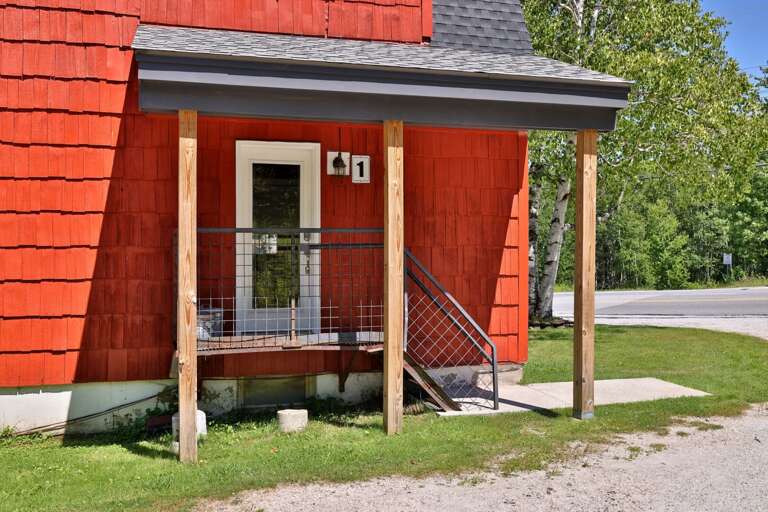 The covered side entrance offers a sheltered place to come and go during your stay.