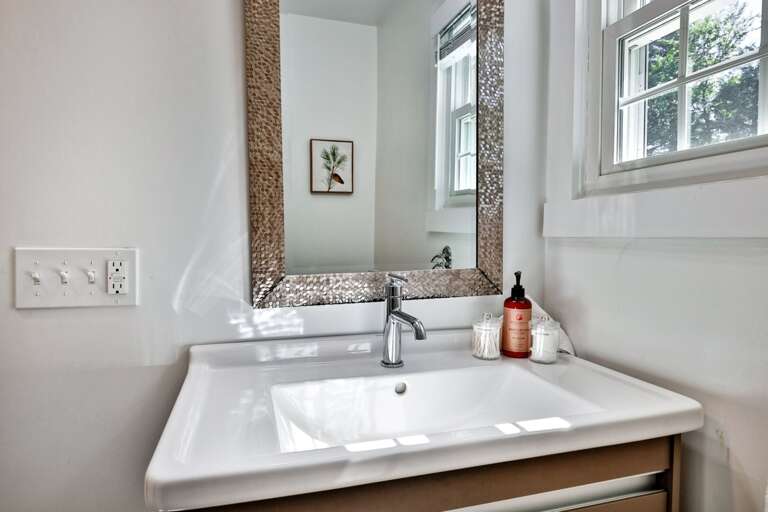 A generous counter and large mirror provide plenty of space for getting ready.