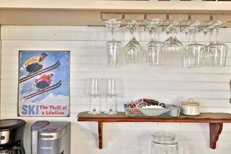 Keep glassware and drink supplies together at this convenient station beside the common areas.