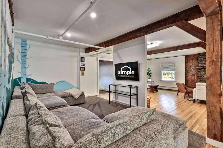 The sectional TV room sits just off the other common areas while still feeling like its own space.