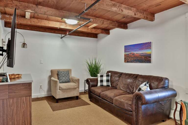 A separate TV room gives guests another place for games, conversation, or a quieter movie night.