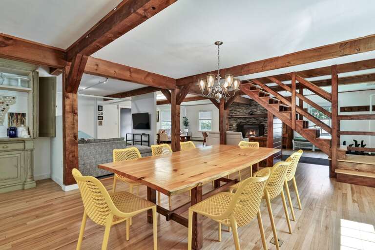 Share meals and map out the day around a long dining table at the heart of the lodge.