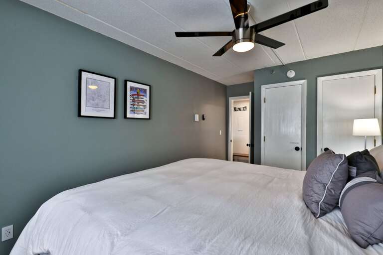 A lamp and nightstand on each side mean no one has to call lights-out early.