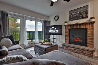 Put your feet up by the brick fireplace, queue up a movie, or slide open the doors for fresh mountain air.