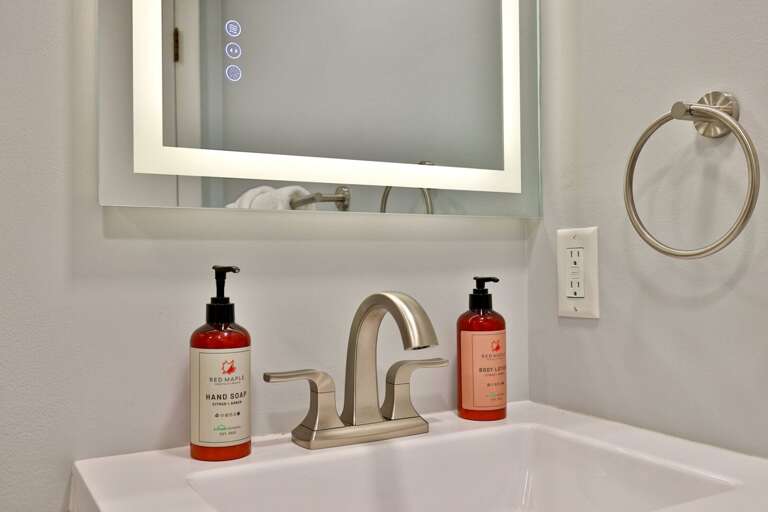 Unpack the bathroom bag into the drawers and cabinet instead of leaving everything on the counter.