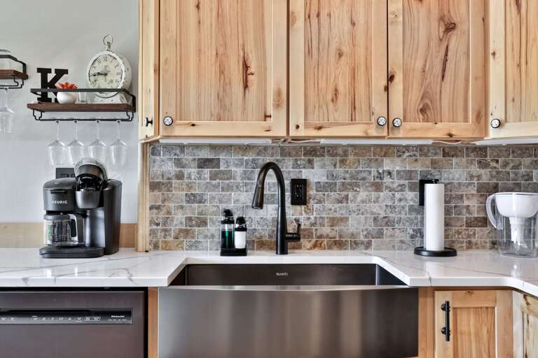 A deep sink and long counter provide useful cleanup and serving space.
