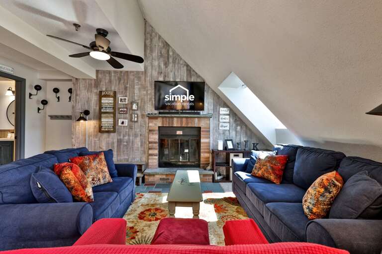 The fireplace anchors a comfortable lounge with plenty of seating for the group.