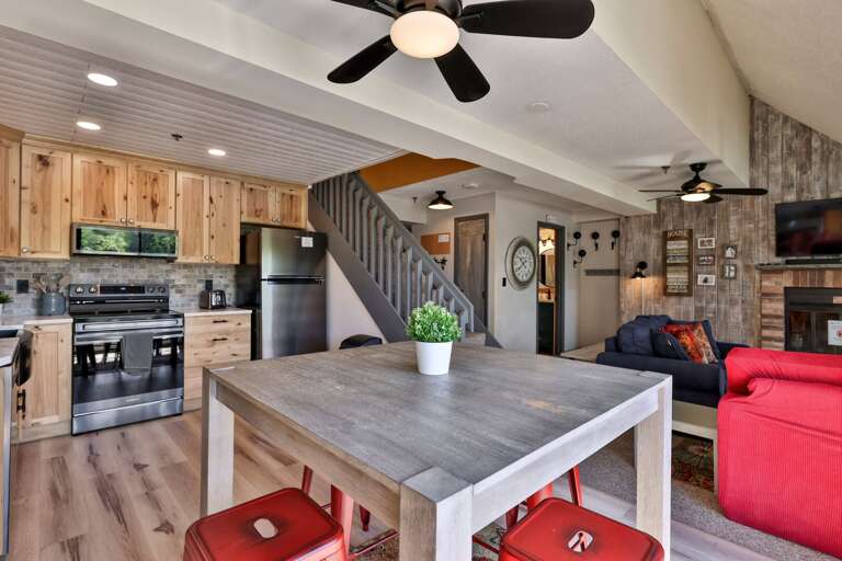 The kitchen island adds prep space while keeping cooks connected to the living room.