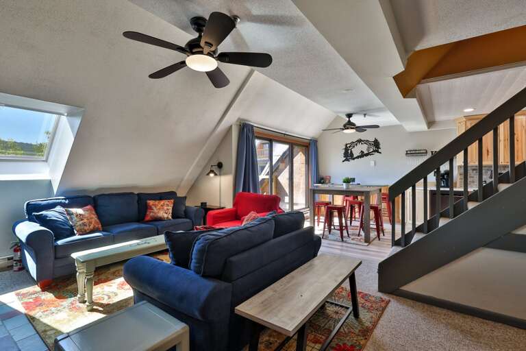 The living room flows directly to the dining area and balcony, keeping the main spaces connected.