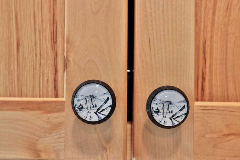 Mountain-themed cabinet pulls add a small sense of place to the kitchen.