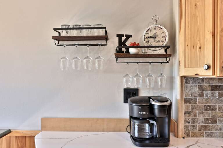 Start the morning at a dedicated coffee station with mugs and glassware close at hand.