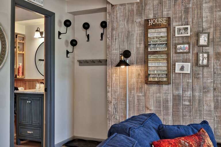 Wall hooks by the entry keep jackets and small essentials within easy reach.