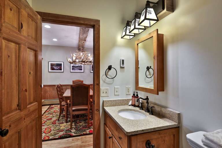 The bathroom is directly off the bedroom, with the vanity and shower steps from the bed.