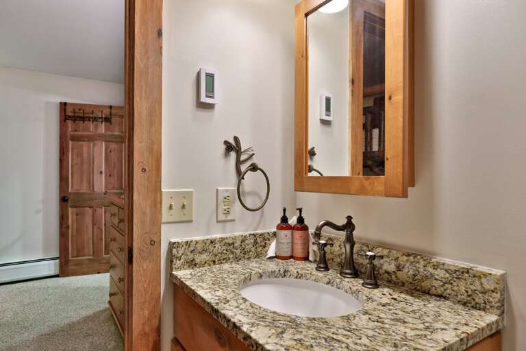 The granite counter has room for the toiletries you reach for every morning.