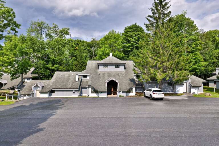 The resort feels residential and tucked away, with established trees between the buildings.