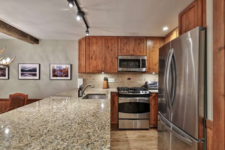 Spread out across the granite counters and cook with full-size stainless appliances close at hand.