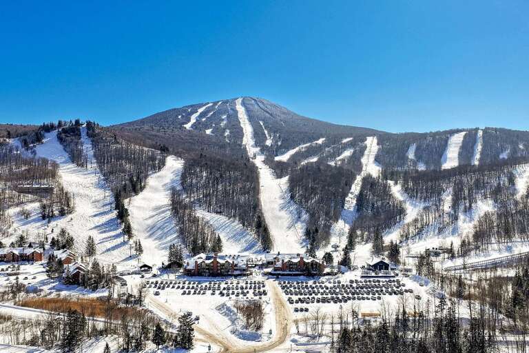 The winter view spans Pico Mountain's ski trails and base buildings.