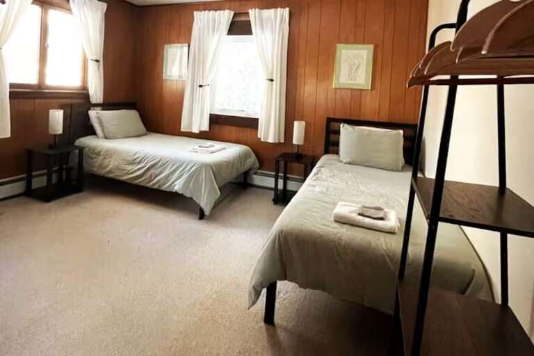 Friends can take a twin bed each in Bedroom 6, which has its own full bathroom.
