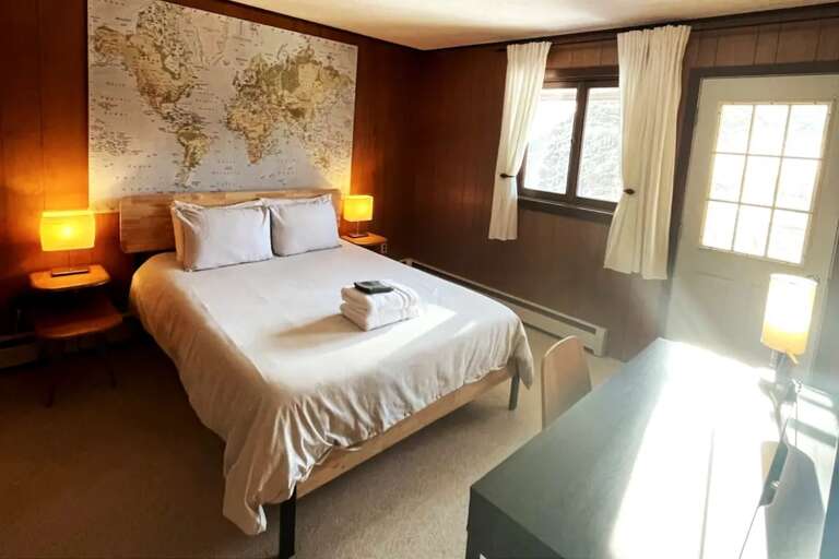 Bedroom 3 pairs a full bed with upper-balcony access and a private full bathroom.