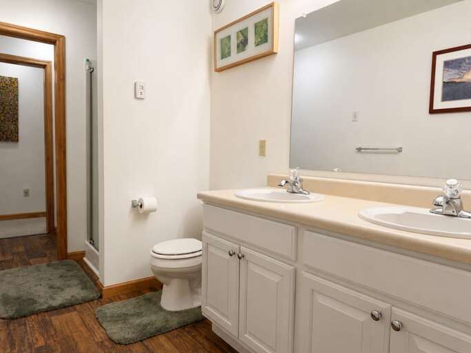 The double vanity lets two people use the sinks at once, with a shower just beside it.