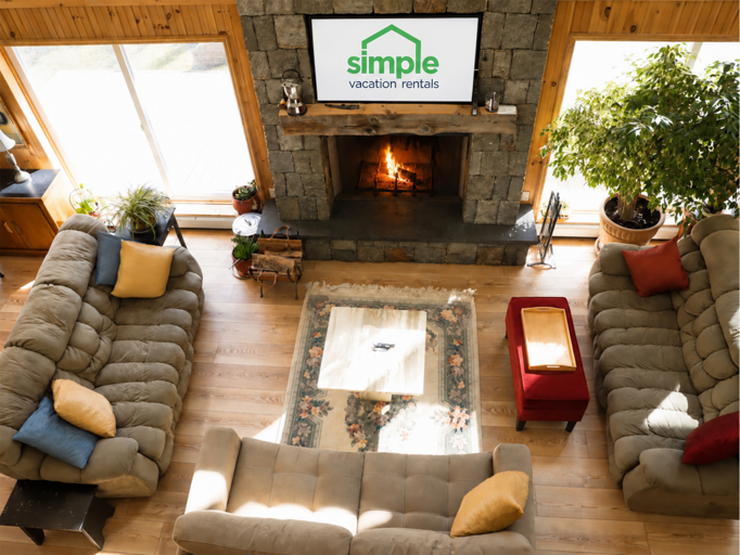 The seating faces inward around the fireplace, ready for an evening catching up with your group.