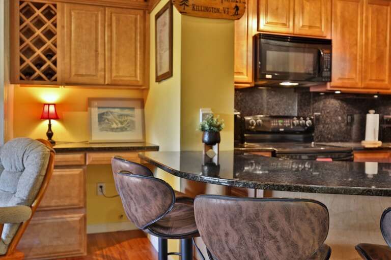 Take a stool while breakfast is being made in the kitchen just across the counter.