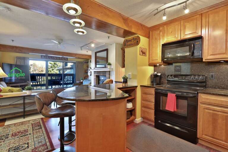 The open kitchen faces the living area, so making a meal needn't separate the group.