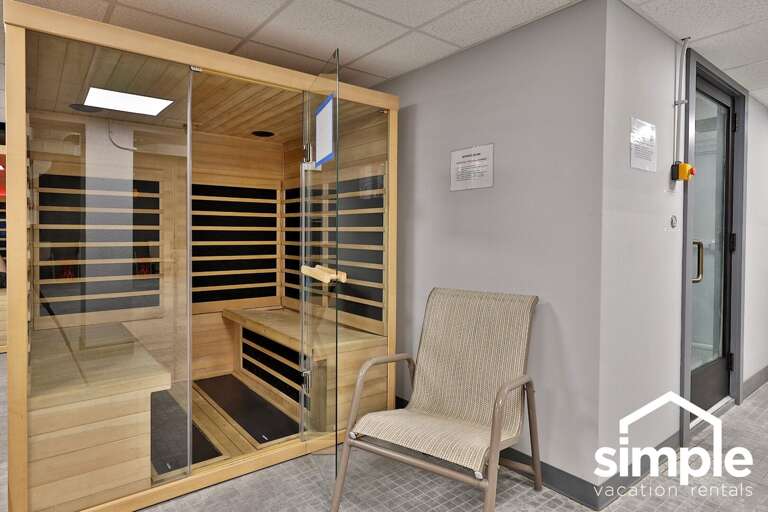 The glass-front sauna is part of the shared recreation facilities.