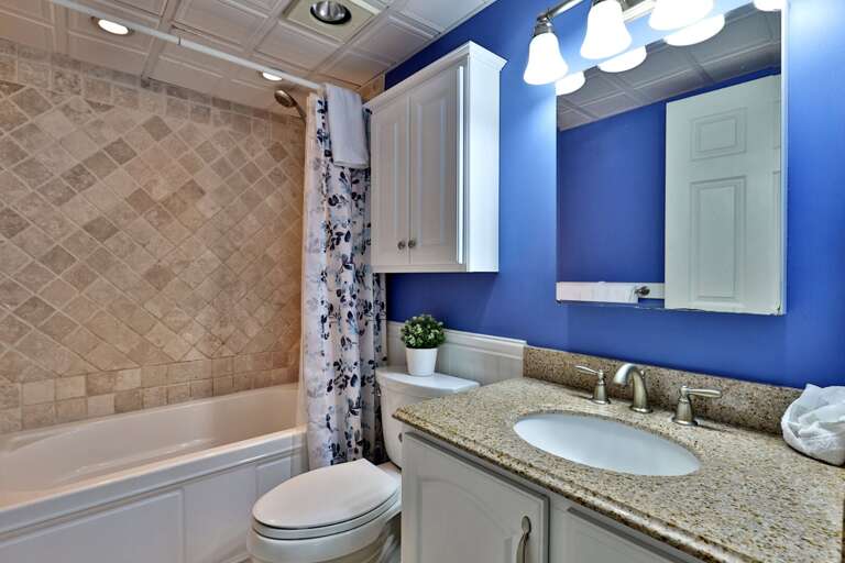 The bathroom's tub-shower gives you both options at the end of the day.