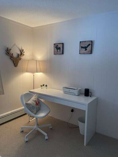 A desk and chair provide a dedicated spot to work during your stay.