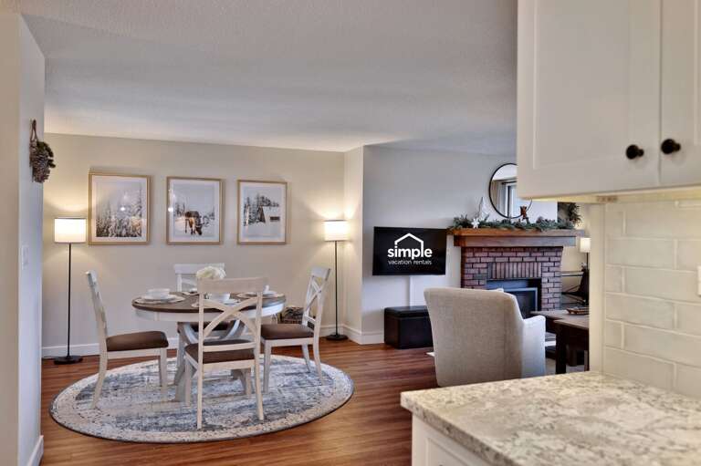 Linger over dinner at the round table before moving to the lounge in the same open space.