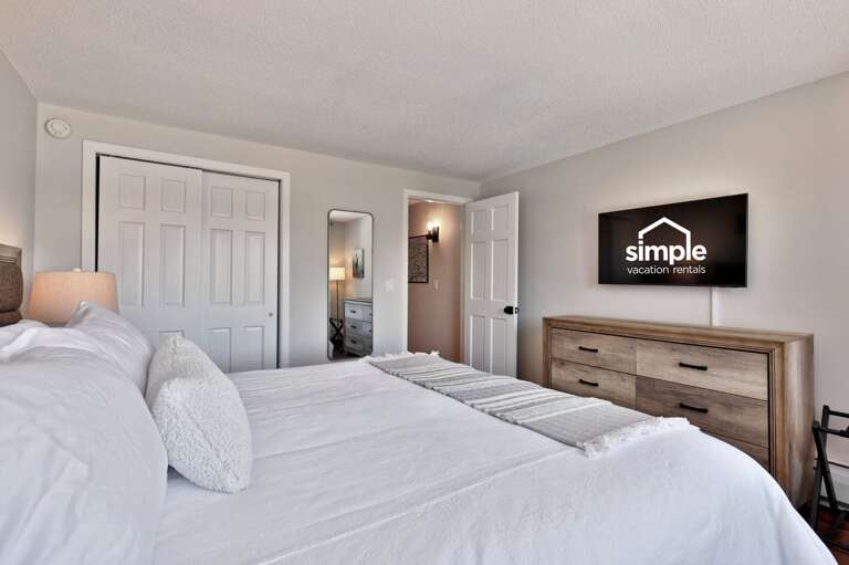 The bedroom TV is opposite the bed, above a dresser where you can unpack.