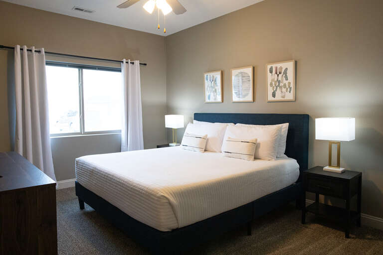 The bedroom has a 12 inch memory foam KING sized mattress, blackout curtains, a TV and more. The bedroom has a 12 inch memory foam KING sized mattress, blackout curtains, a TV and more.