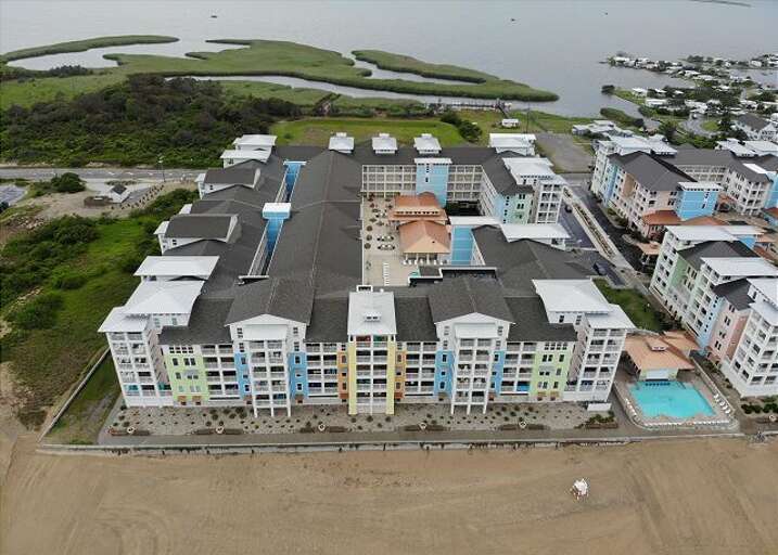 Aerial View Of A Coastal Vacation Rental Complex Near Waterways