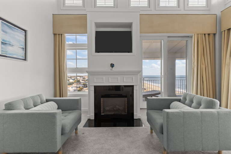 2nd Floor
#1 Primary Bedroom sitting area with a wrap around deck of the Ocean Front and Bay views 