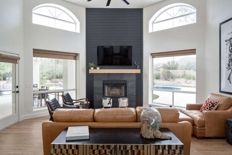 Modern Living Room With Leather Sofa And Black Fireplace Modern Living Room With Leather Sofa And Black Fireplace