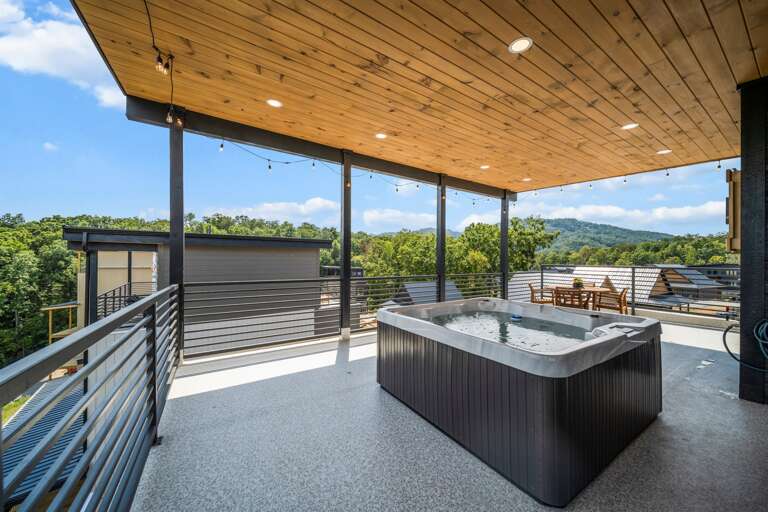 Private rooftop terrace with hot tub, fireplace, and breathtaking sunrise + mountain views.