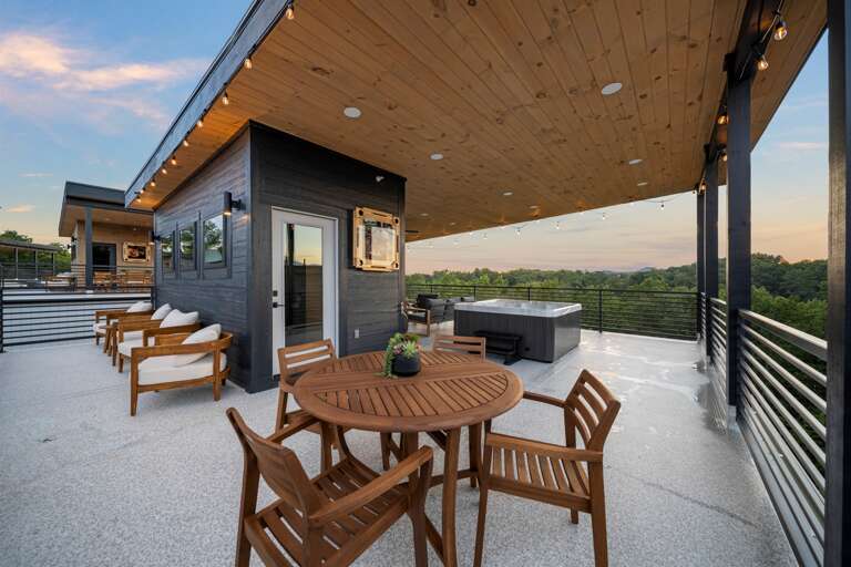 Private rooftop terrace with hot tub, fireplace, and breathtaking sunrise + mountain views.