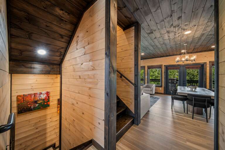 Inviting foyer with natural light, sleek finishes, and views into the living area