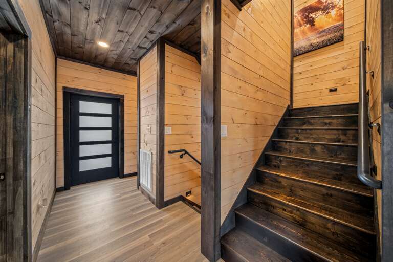 Stylish main-level entrance with staircases and open-concept design