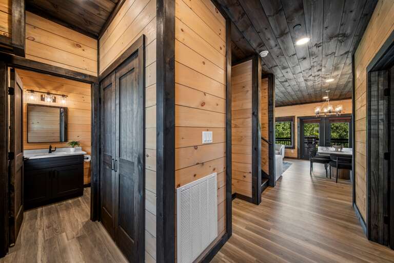 5 full bathrooms + 2 half baths with modern finishes and walk-in showers.