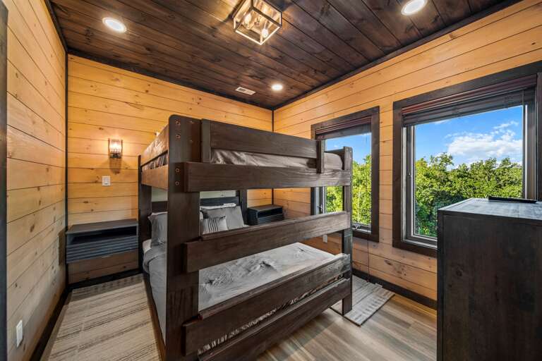 Queen bunk bedroom with private bath — perfect for families.