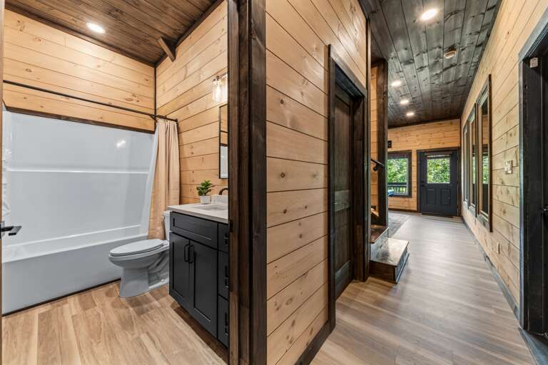 Full bathroom with modern finishes and bathtub in Game Room Area